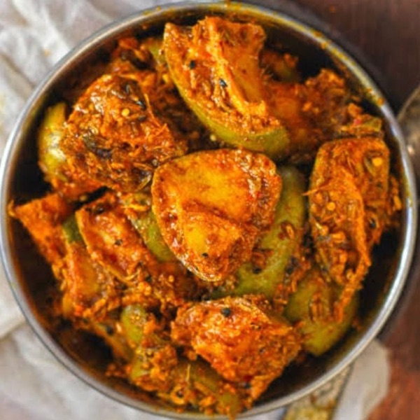 Aam ka achaar - pieces of raw mango in a red spice paste