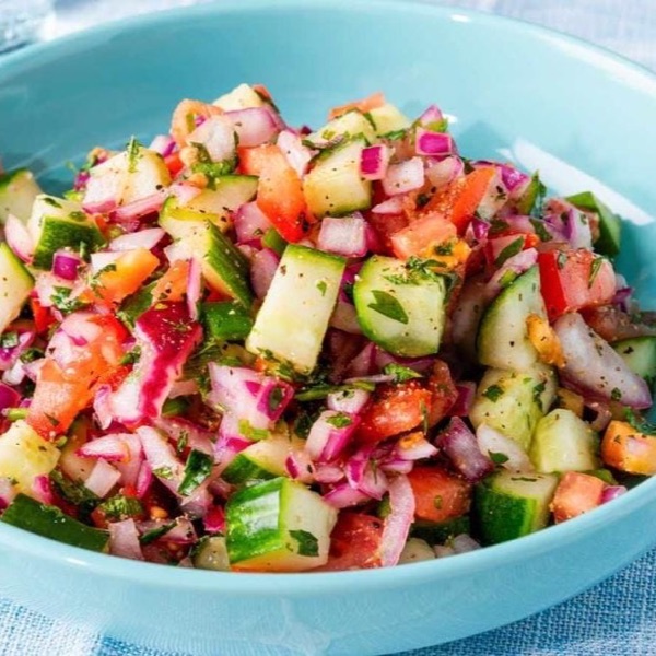 Fresh kachumber salad - chopped cucumber, tomato, onion and coriander